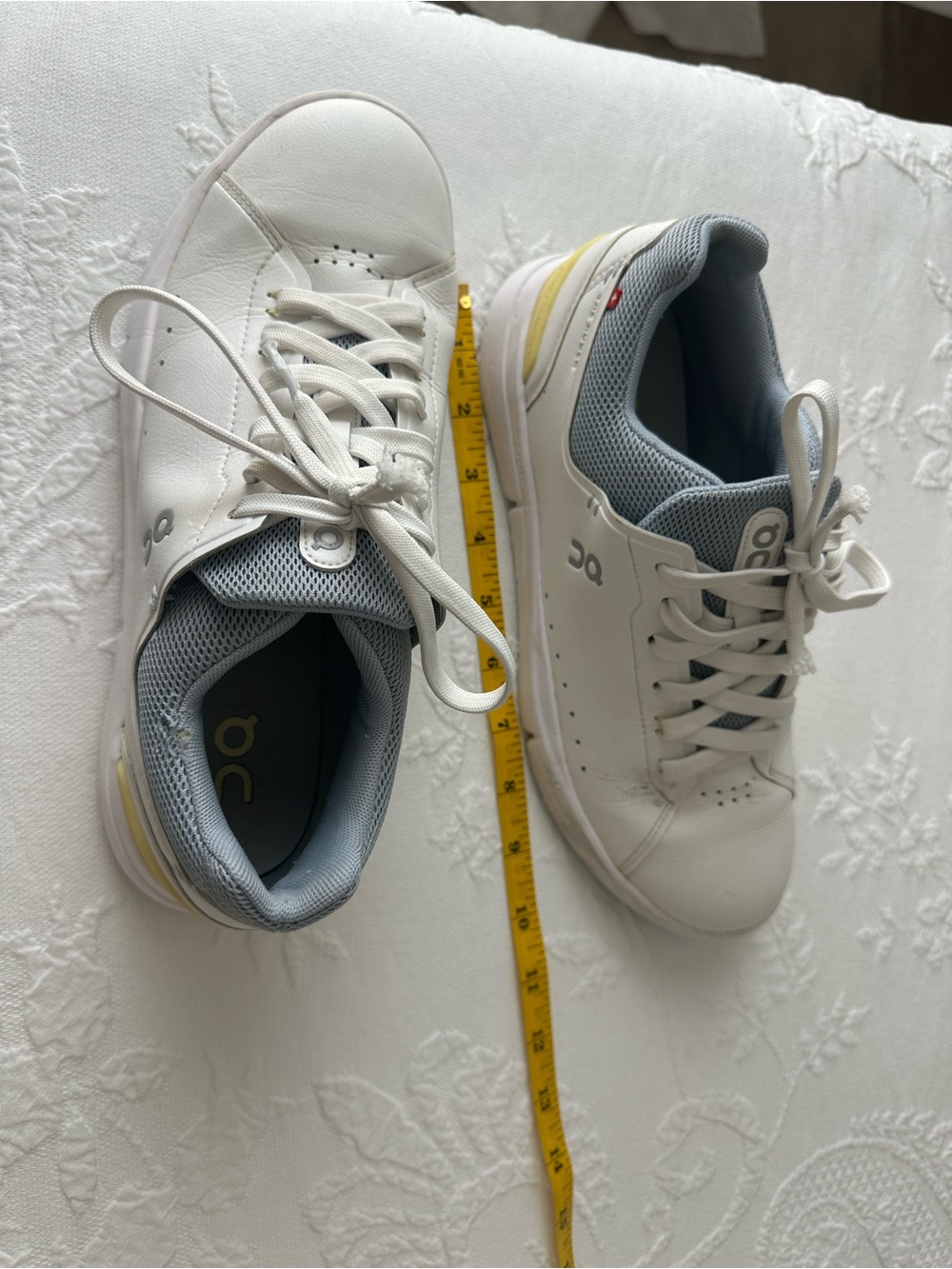 On Running White and Light Gray Athletic Shoes with Yellow Accent